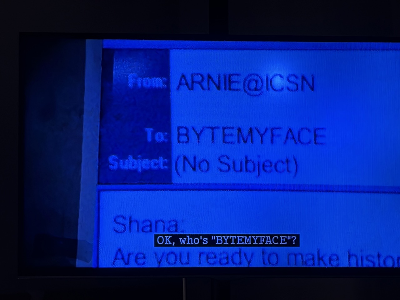 Still from Homicide: Life on the Street. It shows a mocked up email message. From: ARNIE@ICSN / To: BYTEMYFACE, closed caption reads: OK, who's 'BYTEMYFACE'
